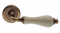 Ручки дверні на круглій розетці Manital VALENCIA OBR / CHA бронза сатин / фарфор шампань